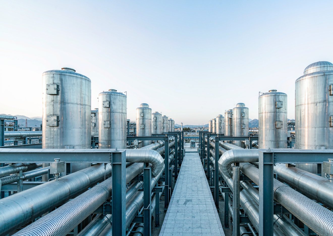 Stainless steel storage tanks and process piping at a chemical plant